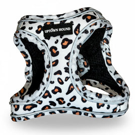 Leopard print dog harness with 'Uptown Hound' label on a light gray background