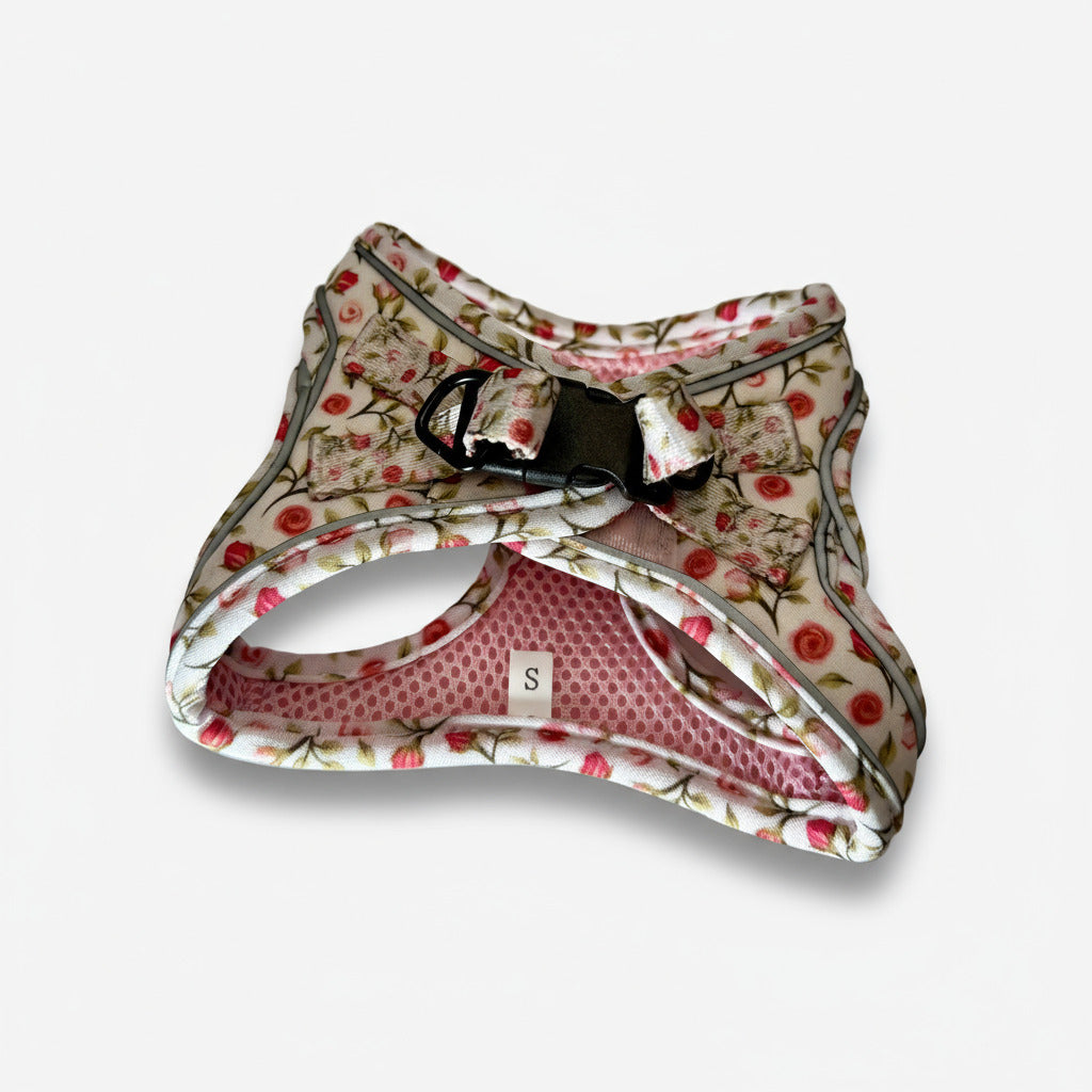 Floral-patterned dog harness on a white background
