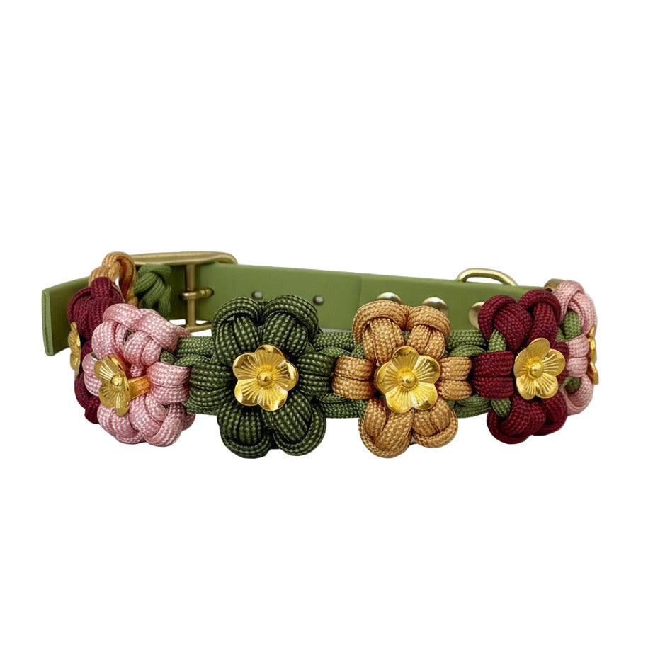 Decorative dog collar with floral patterns on a white textured surface