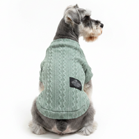 Silver Schnauzer back view in sage green cable-knit tee